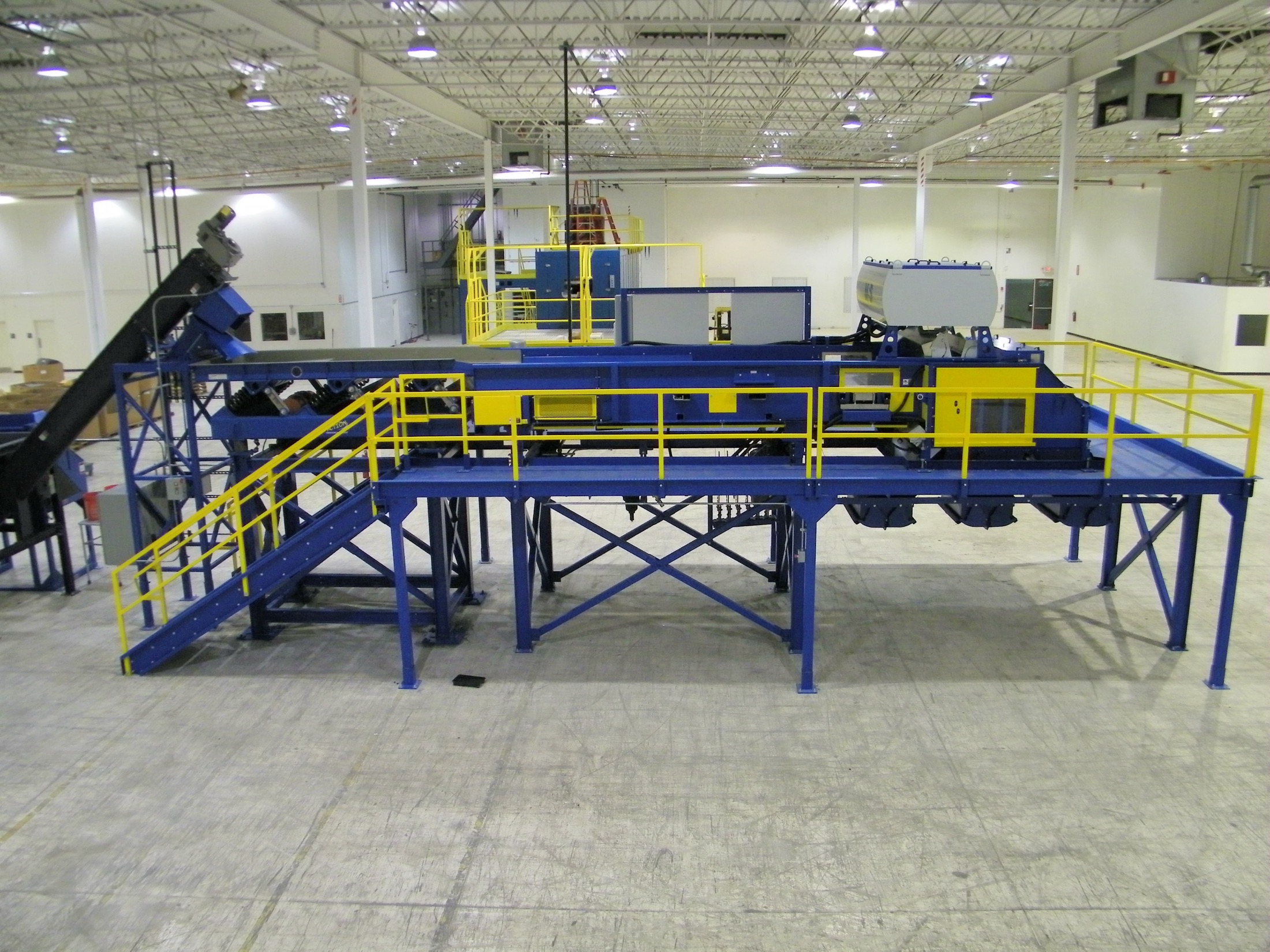 A complete Remcon conveyor and sort system installed and running in a customer facility