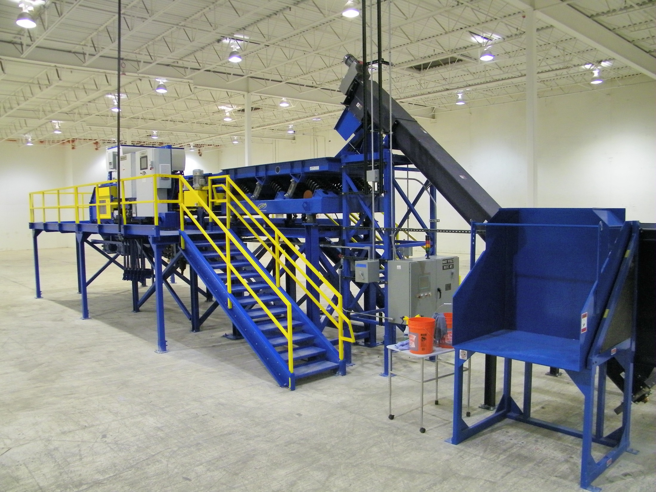 Complete turn-key sort system with disc screen, access catwalk, stairs, and motor control center